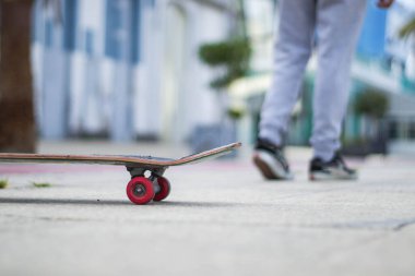 Selective focus: skate with a boy walking in the background