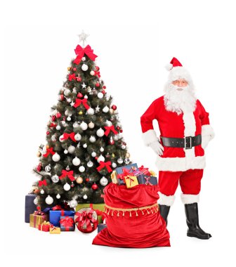 Noel Baba Noel ağacının yanındaki