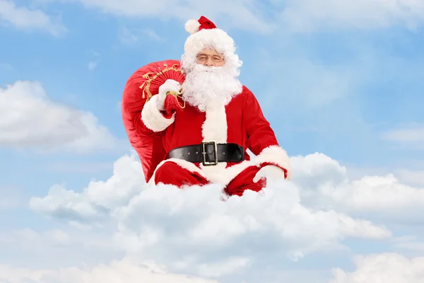 Santa Claus with bag and flying — Stock Photo, Image