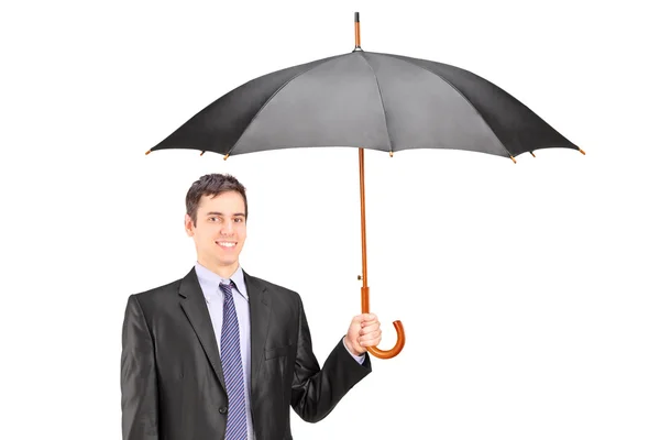 Hombre sosteniendo un paraguas — Foto de Stock