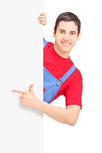 Repairman pointing on blank panel — Stock Photo, Image