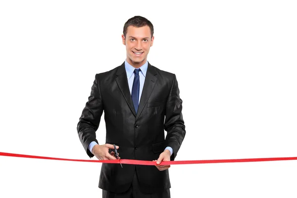 Man cutting red ribbon — Stock Photo, Image