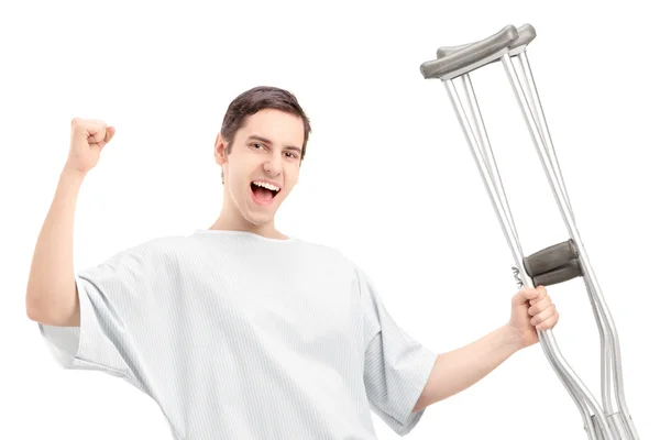 Male patient holding crutches — Stock Photo, Image