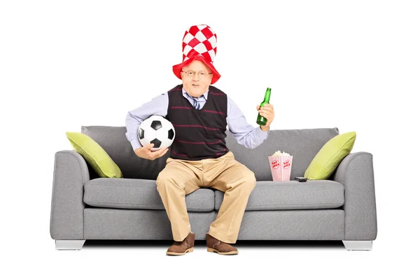 Sport fan holding ball and beer — Stock Photo, Image