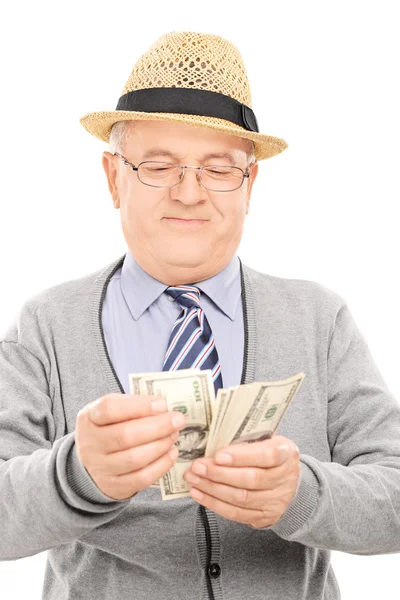 Senior gentleman counting money — Stock Photo, Image