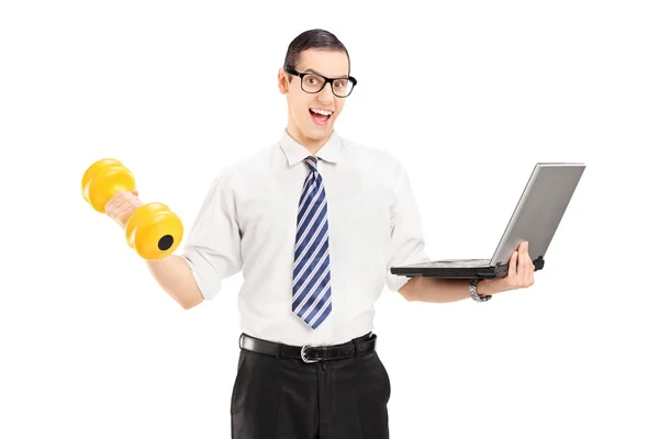 Businessman holding dumbbell and laptop — Stock Photo, Image