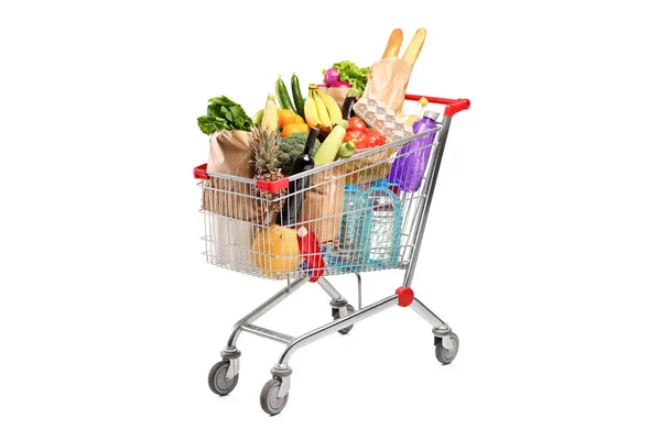 Shopping cart with various groceries — Stock Photo, Image