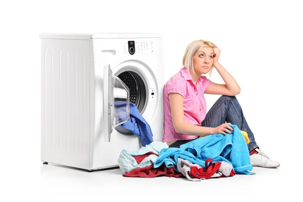 Woman next to washing machine — Stock Photo, Image