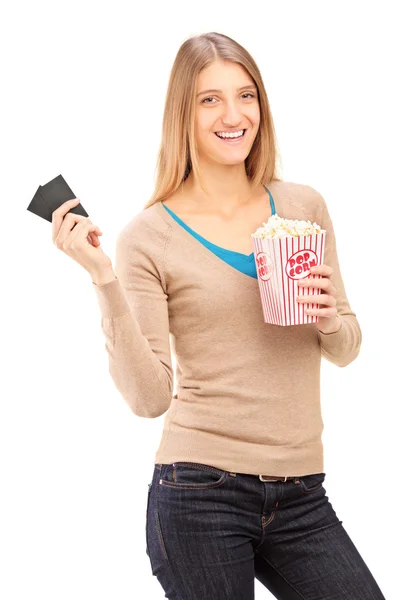 Girl holding tickets and popcorn — Stock Photo, Image