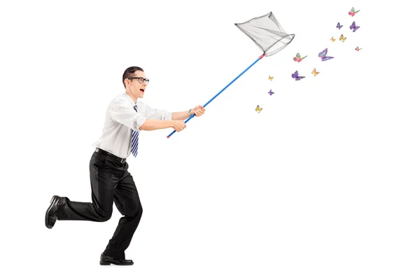 Man catching butterflies with net — Stock Photo, Image