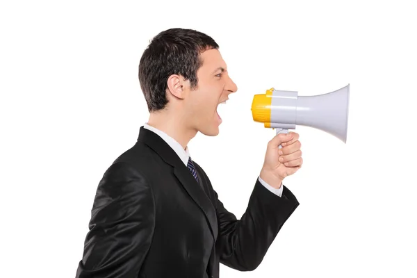 Businessman shouting via megaphone — Stock Photo, Image