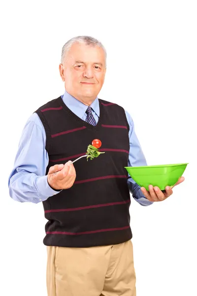 Mature gentleman eating salad — Stock Photo, Image