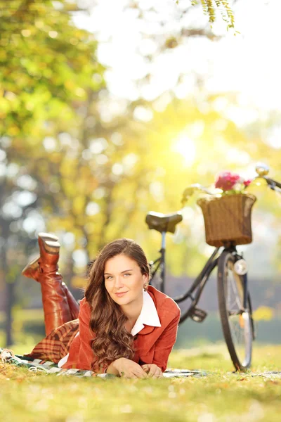 Female with bicycle in park — Stock Photo, Image