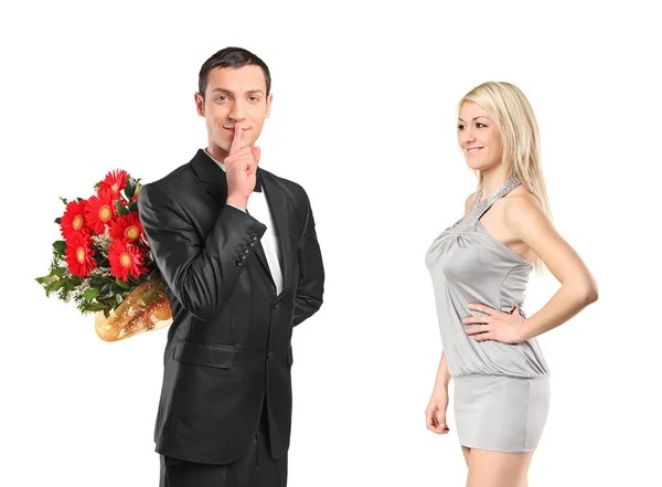 Man holding flowers and woman — Stock Photo, Image