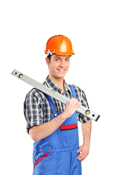 Constructor worker holding bubble level — Stock Photo, Image
