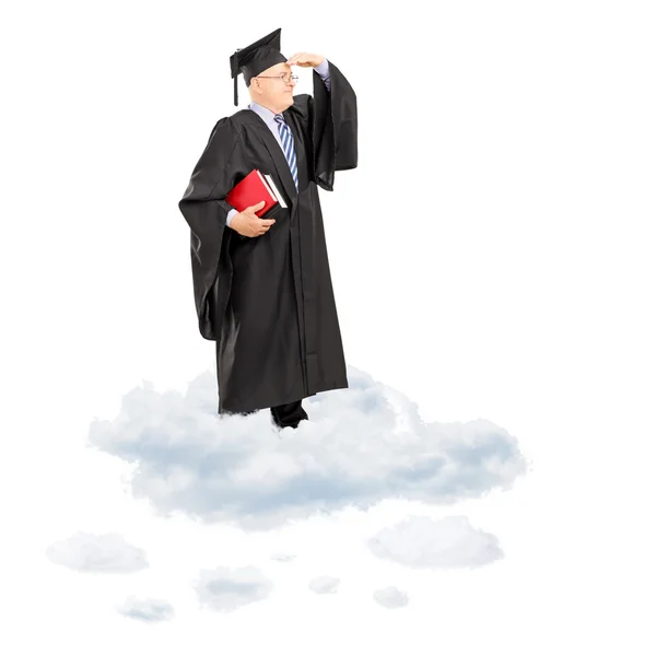 Professor in graduation gown on cloud — Stock Photo, Image