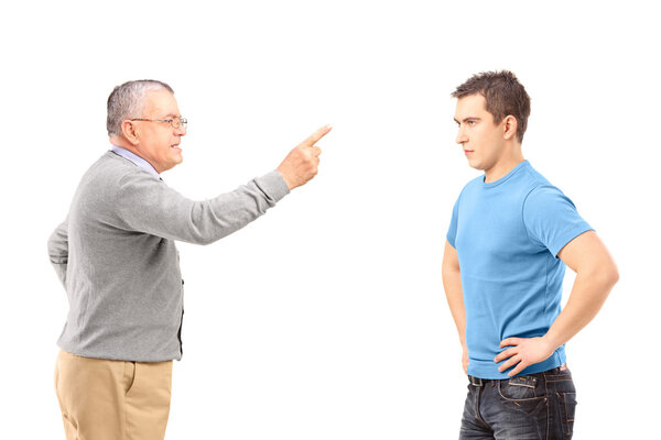 Angry father reprimanding son