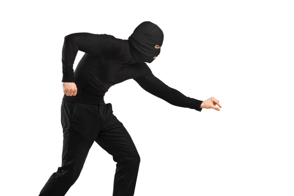 A man trying to steal something — Stock Photo, Image