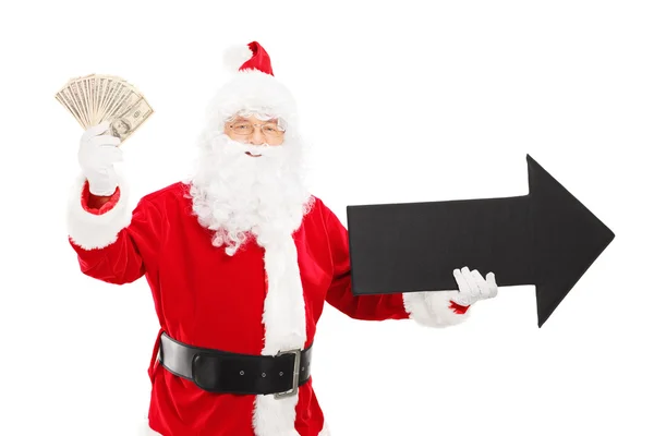 Babbo Natale tenendo freccia e dollari — Foto Stock