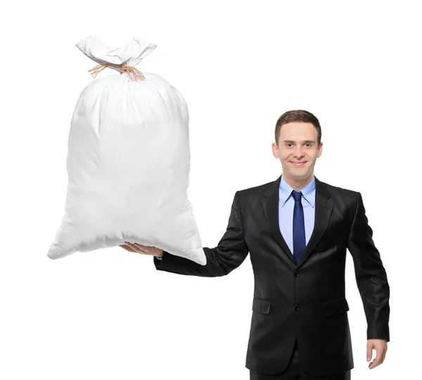 Businessman holding bag with money — Stock Photo, Image