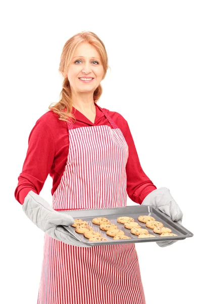 Woman with baked cookies — Stock Photo, Image