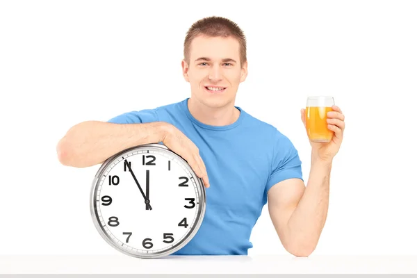 Guy holding wall clock — Stock Photo, Image