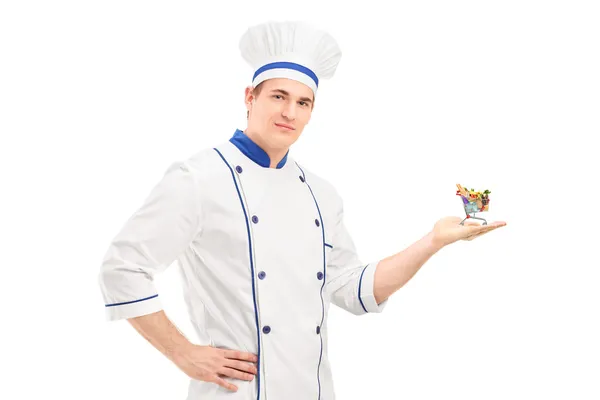 Chef holding small shopping cart — Stock Photo, Image