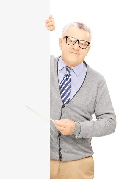 Senior man next to blank panel — Stock Photo, Image