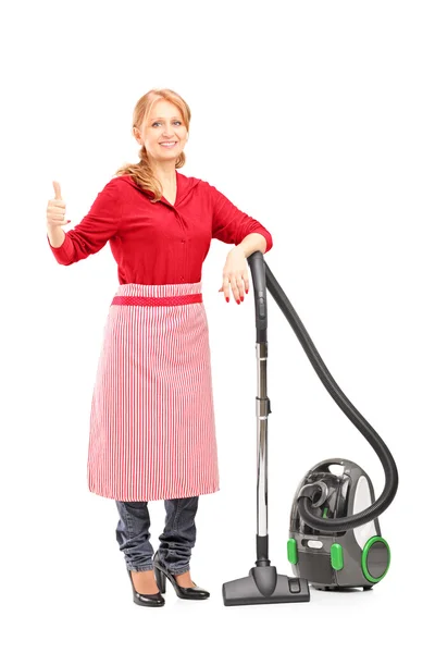 Housewife on vacuum cleaner — Stock Photo, Image