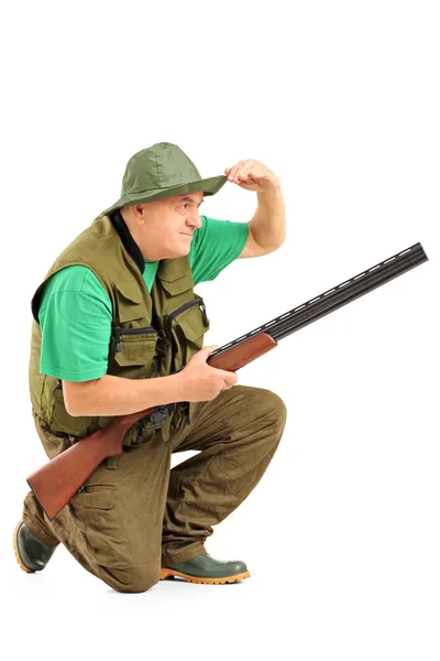 Rifle crouching and looking in distance — Stock Photo, Image