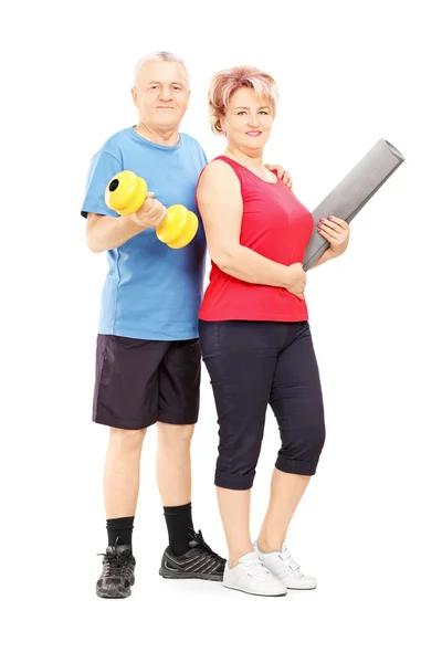 Man and woman posing with dumbbell — Stock Photo, Image