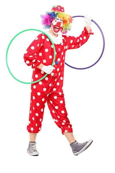 Funny clown holding hula hoops — Stock Photo, Image