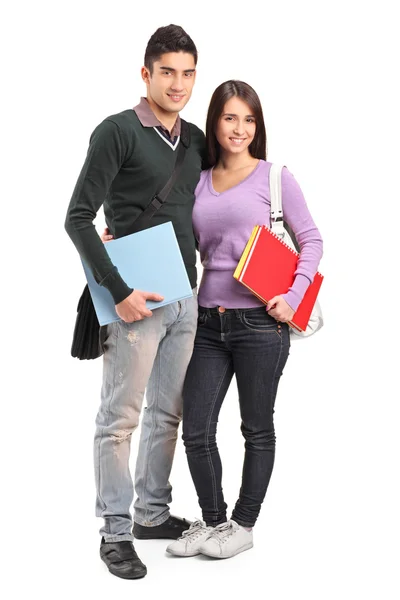 Pareja sonriente sosteniendo libros — Foto de Stock