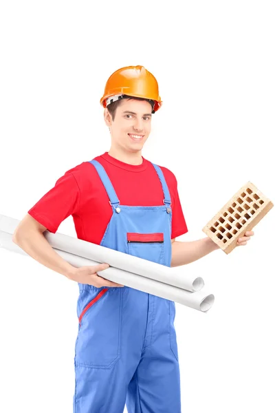 Male construction worker holding brick — Stock Photo, Image