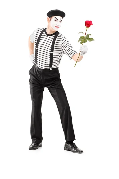 Mime asrtist giving rose flower — Stock Photo, Image