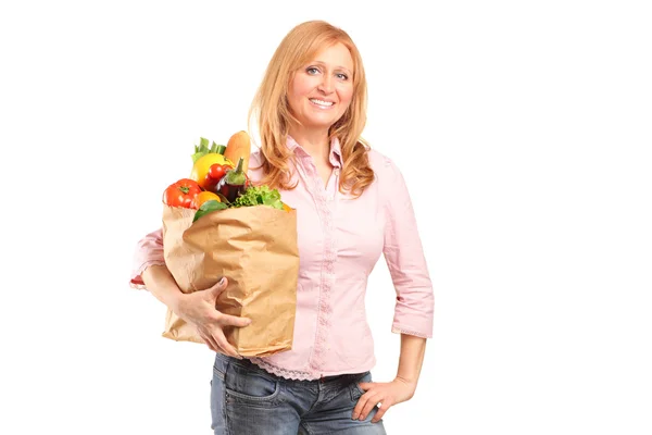 Woman holding paper bag — Stock Photo, Image