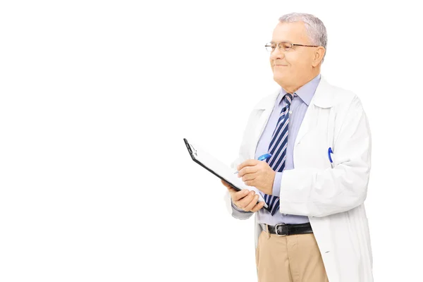 Male doctor holding clipboard — Stock Photo, Image