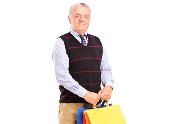 Cavalheiro segurando sacos de compras — Fotografia de Stock