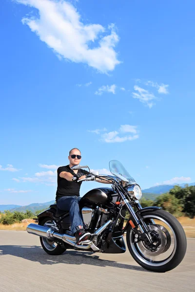 Biker riding customized motorcycle — Stock Photo, Image