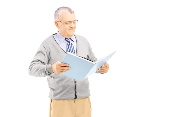 Middle aged gentleman reading book Stock Picture