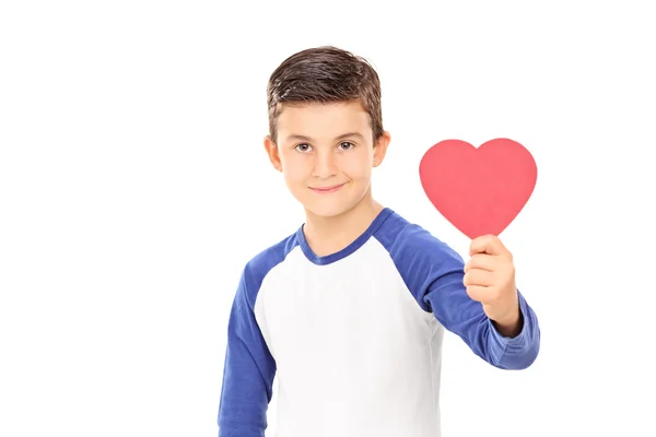 Young boy holding a red heart Royalty Free Stock Images