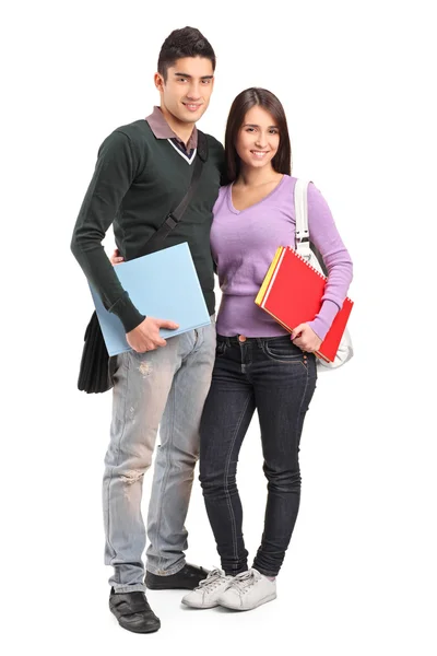 Smiling couple holding books Stock Image