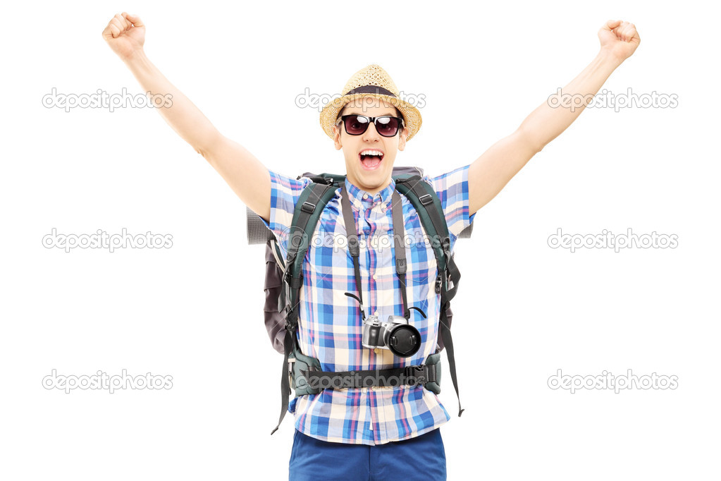 Male hiker with raised hands
