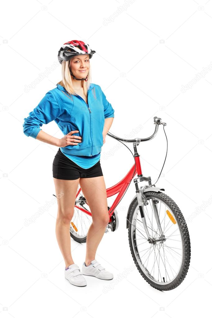 Female biker next to bike