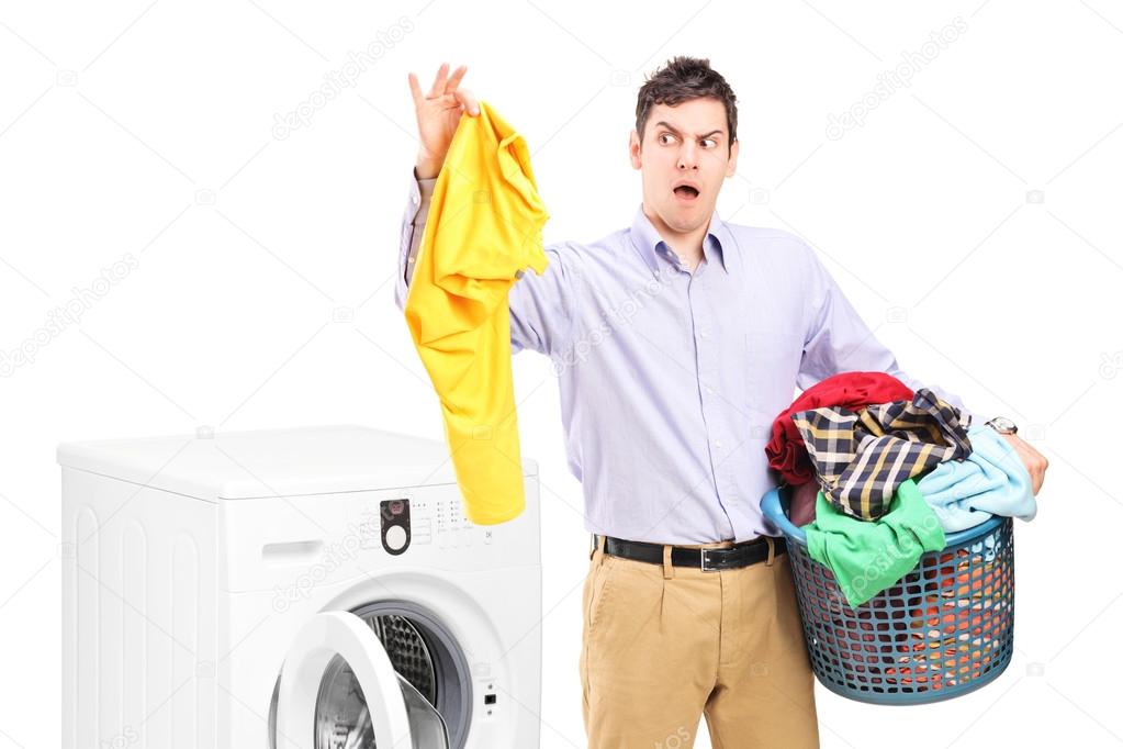 Man standing next to washing machine