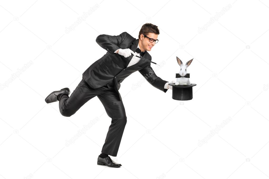 Magician holding top hat with rabbit