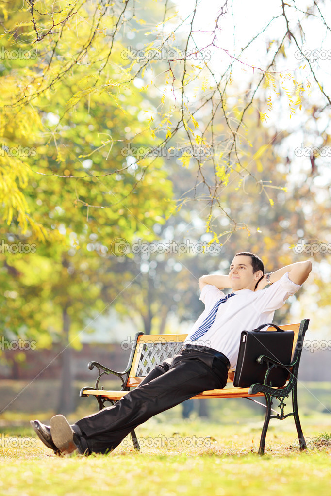 Businessman relaxing in a park