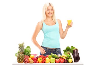 Female holding glass of juice clipart
