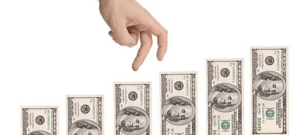 Hand gesturing moving over US dollars — Stock Photo, Image