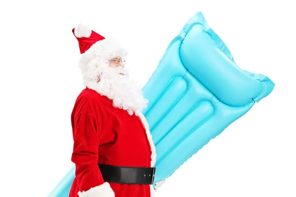 Weihnachtsmann mit Schwimmmatratze — Stockfoto
